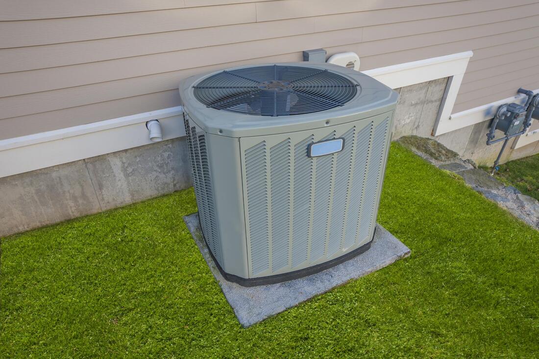 air conditioner in the grass